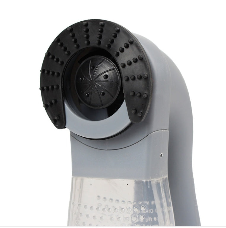 Portable pet hair vacuum cleaner showing silicone bristle roller head and clear dust chamber