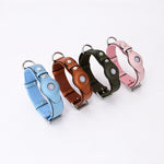 Set of leather pet collar trackers with protective pouch in blue, brown, green, and pink