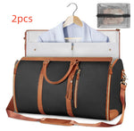 2-piece waterproof travel duffel set, black bags with tan handles and zipper tassels
