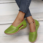 Green perforated women's wedge sandals with round toe and sling strap