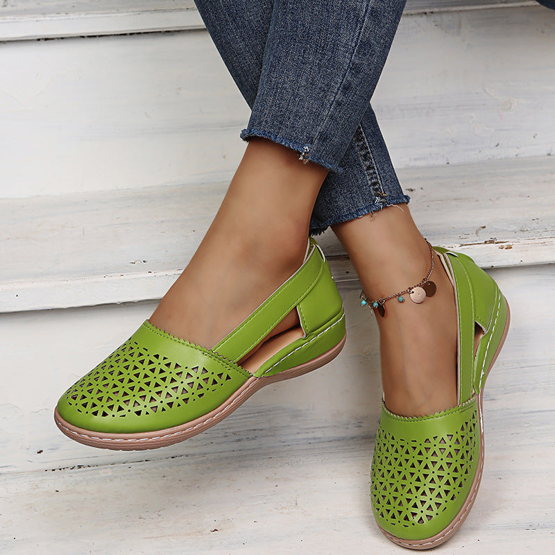 Green perforated women's wedge sandals with round toe and sling strap