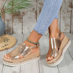 Gold shiny wedge sandals with open toe, square buckle ankle strap, woven platform sole
