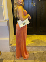 Shiny orange cutout slit maxi dress with twisted halter top and high side slit