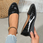 Women’s pointed toe cross-strap wedge flats in black patent leather with elastic band
