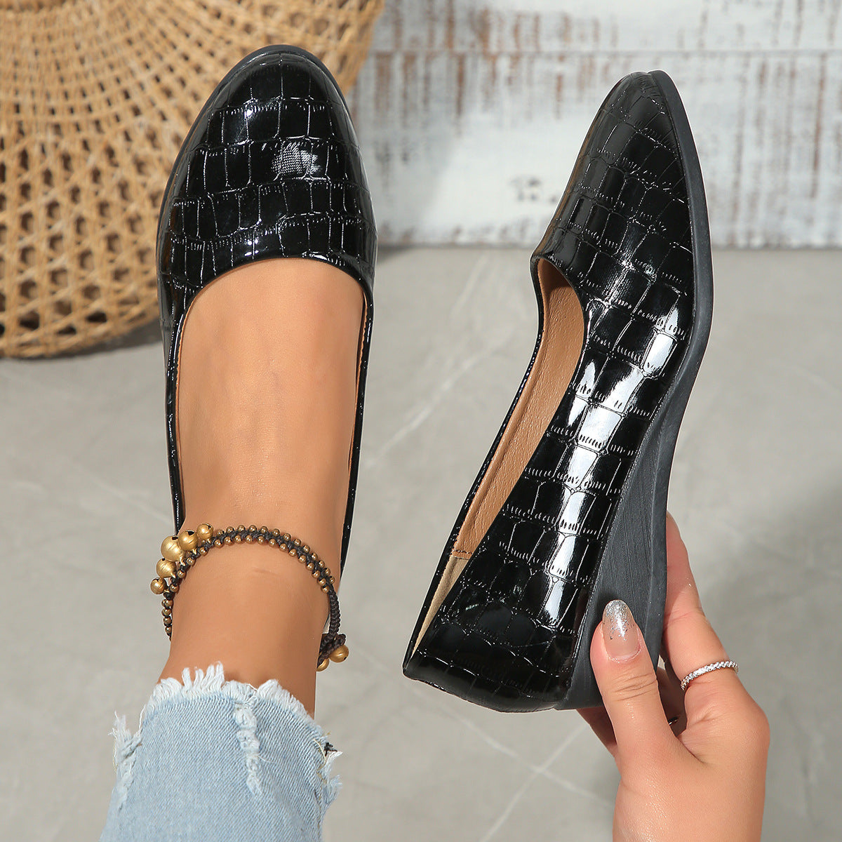 Women’s pointed toe cross-strap wedge flats in black patent leather with elastic band