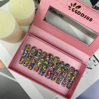 Long rhinestone mosaic press-on nails in a pink tray, multicolor bead design