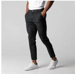 Black slim-fit business trousers with button waistband, tapered straight legs, side pockets