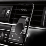 Magnetic car phone holder with vent clip and slim black ring mount on dashboard