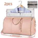 Light pink waterproof duffel bag with open interior, tassel zippers, shoulder strap