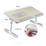 Adjustable foldable laptop desk stand with 52cm x 30cm top and adjustable legs 24–32cm