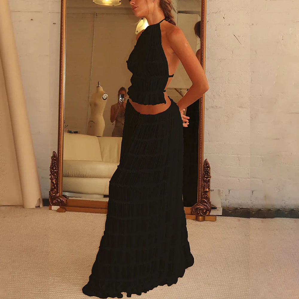 Black halter crop top and tiered pleated maxi skirt set with layered ruffle tiers