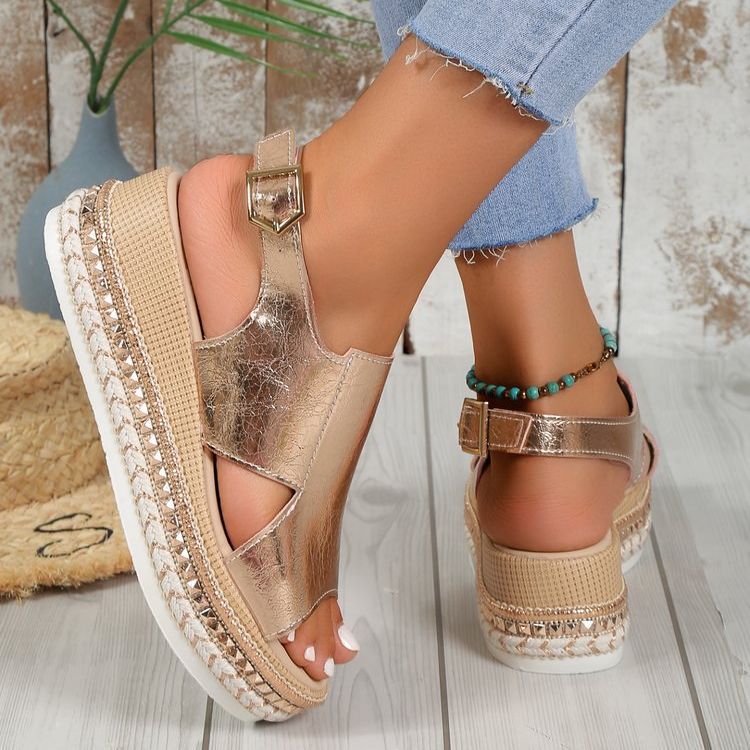 Gold shiny wedge sandals with square buckle ankle strap and crisscross upper