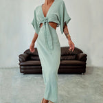 Women's green maxi dress with tie-front V-neck and cutout shoulders, long fitted silhouette