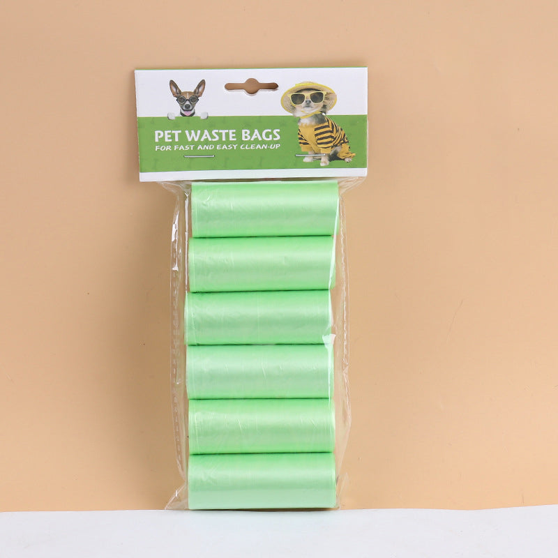 Green pet waste bag rolls in retail package