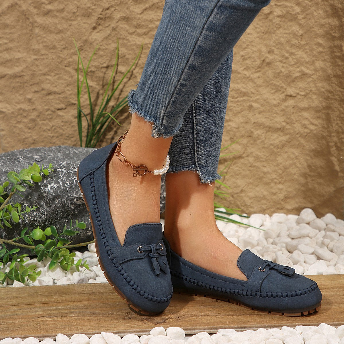 Women’s navy blue suede loafers with round toe, lace-up bow, stitched flat sole