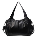 Women’s retro PU handbag with top handles, black, two front zip pockets and side straps.