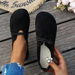 Black suede round-toe flat lace-up shoes with pearl flower accent