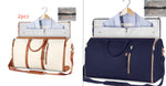 Waterproof duffle set, white bag with brown straps and navy bag with tassel zips