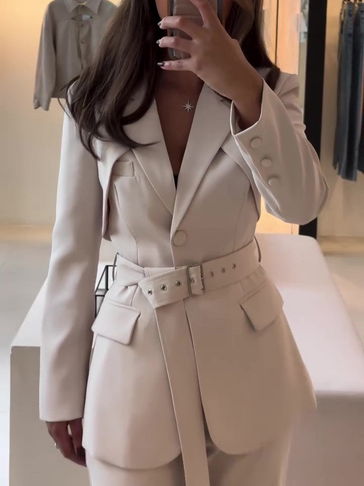 Beige belted blazer and high-waist pants set, long sleeves, buttoned front, flap pockets.