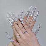 Long almond silver rhinestone press-on nails with dense sparkle and 3D crystal highlights