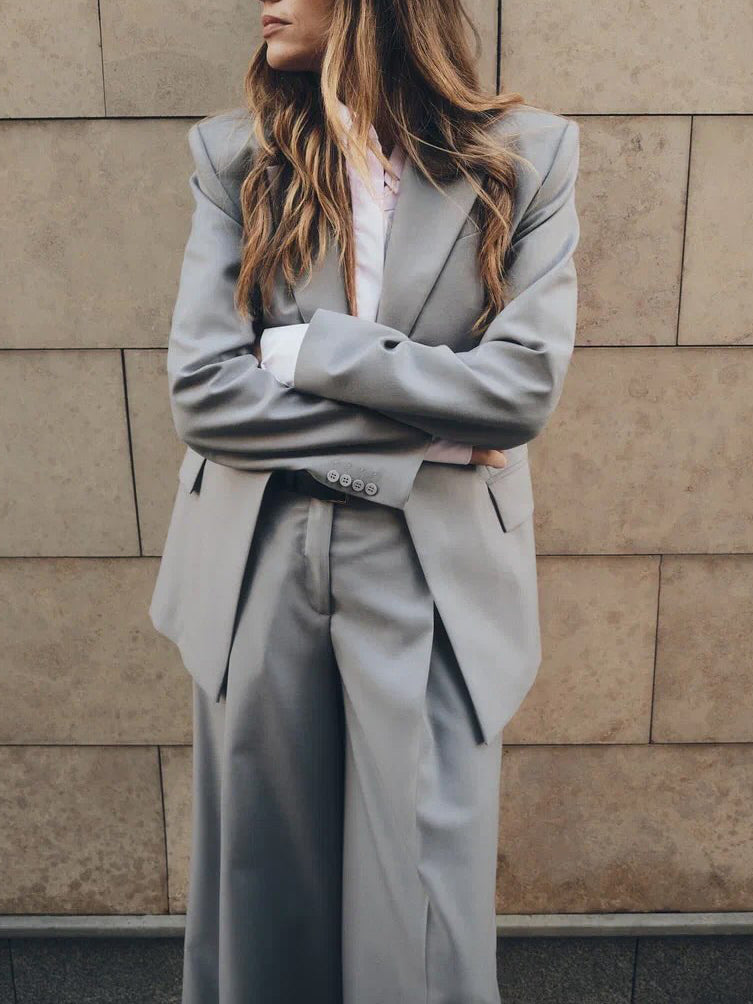 Light gray blazer and wide-leg pants suit with notch lapels, belt loops detail