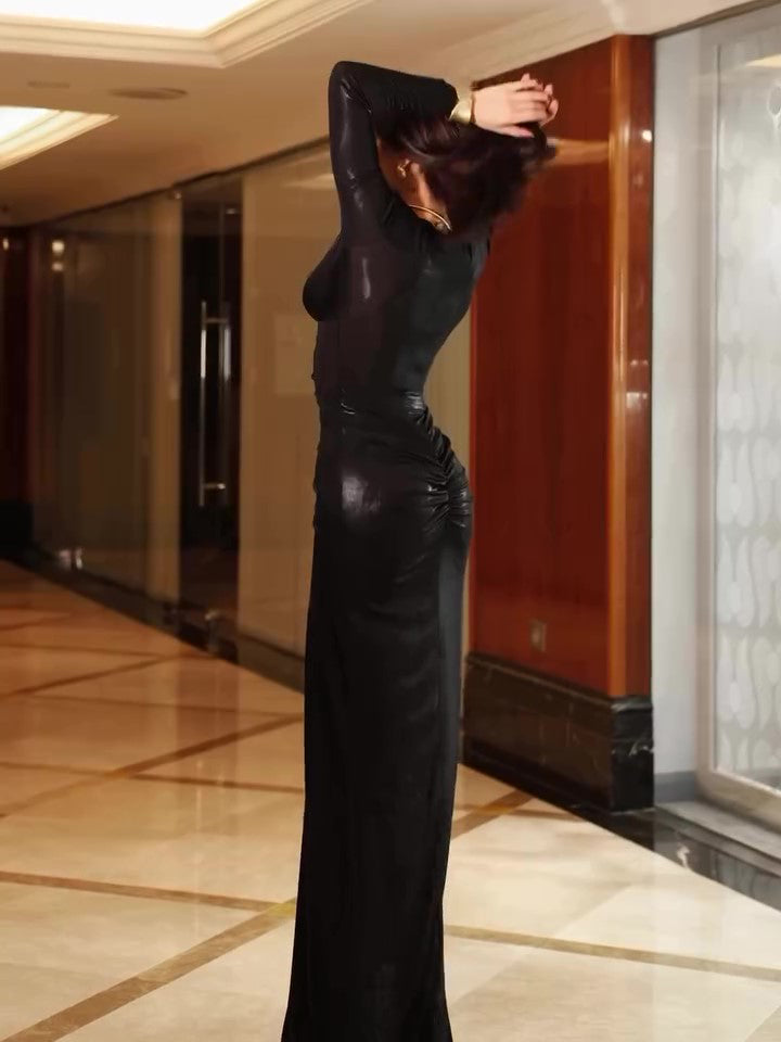 Black pleated maxi dress with long sleeves, slim fit, back silhouette.