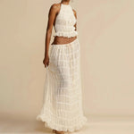 White halter crop top and pleated long skirt set with tiered ruffles and gathered waist