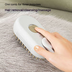 Electric steam pet brush with white oval body and tan bristle tips