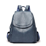 Women's PU leather travel backpack with front flap and side zippers, peacock blue