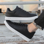 Black lace-up flat casual shoes with round toe and white textured sole