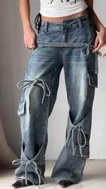 Denim utility jeans with cargo pockets, knot-tied drawcords, patchwork panels, wide-leg