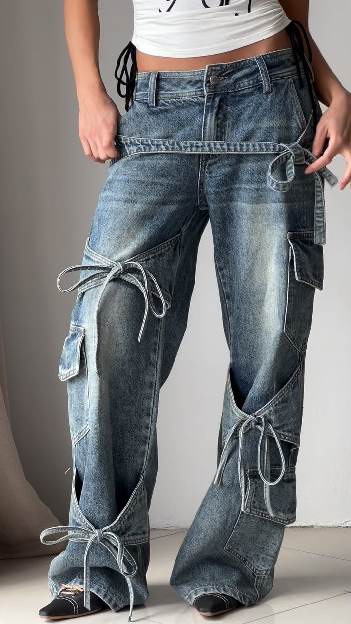 Denim utility jeans with cargo pockets, knot-tied drawcords, patchwork panels, wide-leg
