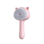 Handheld slicker pet grooming brush with gray pins, pink cat-ear head and handle