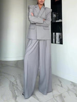 Light gray single-button blazer and wide-leg pants suit with flap pockets, front view