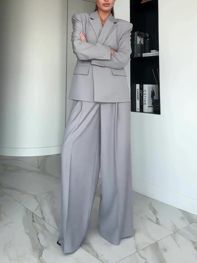 Light gray single-button blazer and wide-leg pants suit with flap pockets, front view