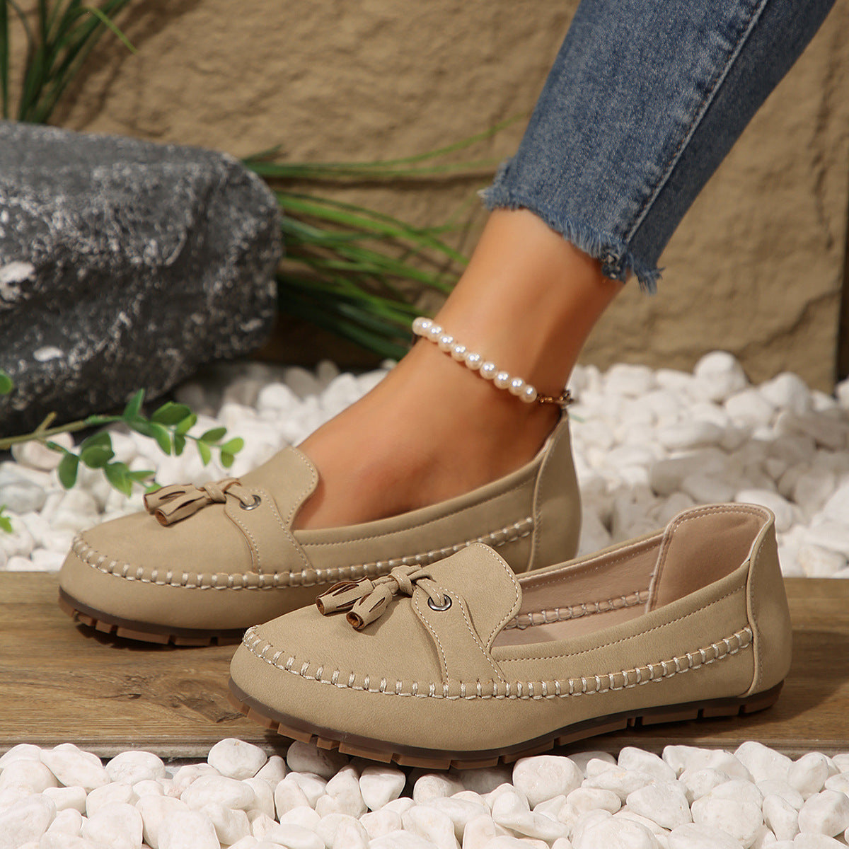 Women’s beige suede loafers with round toe, tassel lace, stitched flat sole