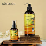 Argan oil hair oil pump bottle with mini bottle and box, on a wooden stand
