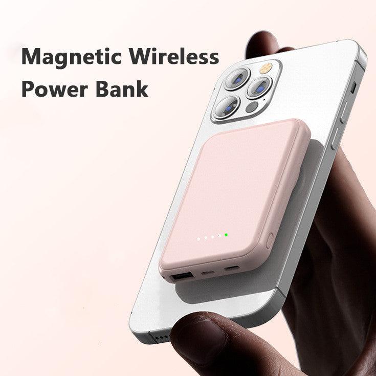 Pink magnetic wireless power bank attached to a smartphone with charging indicator lights