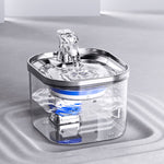 Automatic pet water fountain with stainless rim, transparent tank, and water flow