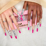 Extra-long stiletto press-on nails with zebra print, leopard dots, and rhinestone accents