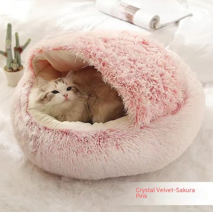 Round plush pet bed with pink fuzzy top edge, cat curled inside