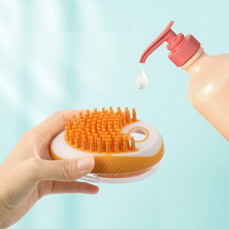 Pet bath brush with orange bristle side and shower gel dispenser dropping onto pads