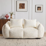 White plush bean bag loveseat sofa with three front pillows and curved backrest