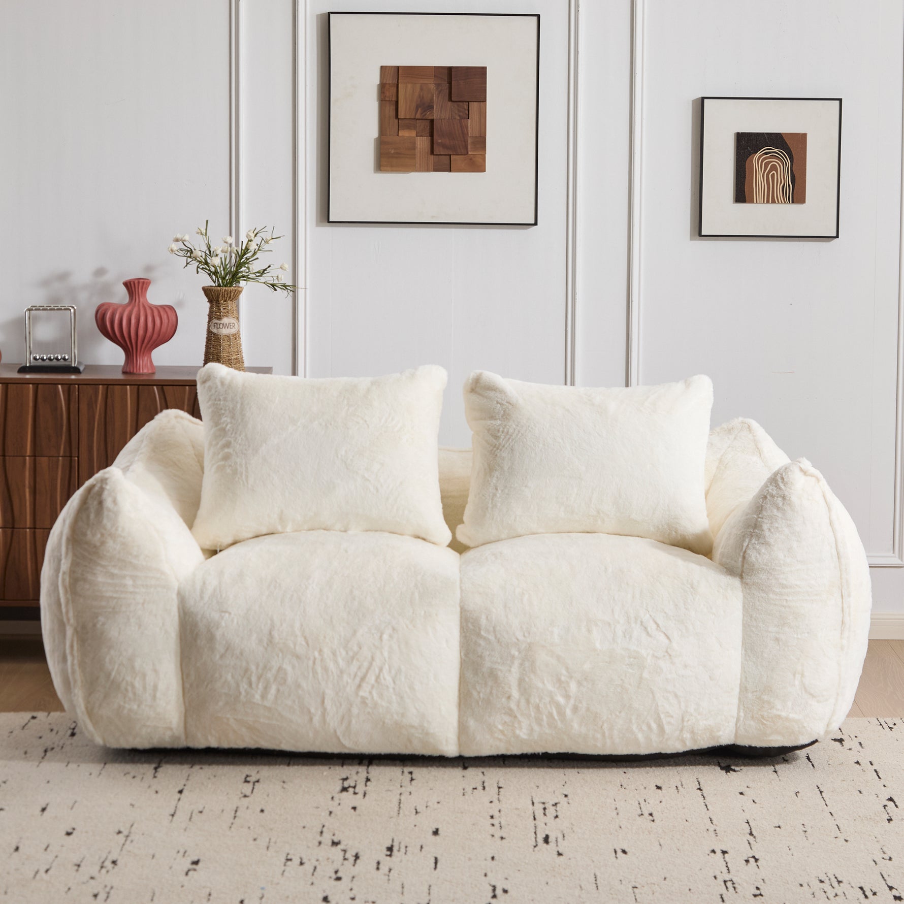 White plush bean bag loveseat sofa with three front pillows and curved backrest