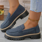 Women’s matte dark blue flat loafer shoes with round toe, buckle strap, and thick tread sole