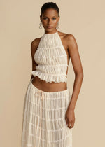 White halter crop top and pleated long skirt set with tiered ruffles and elastic waist
