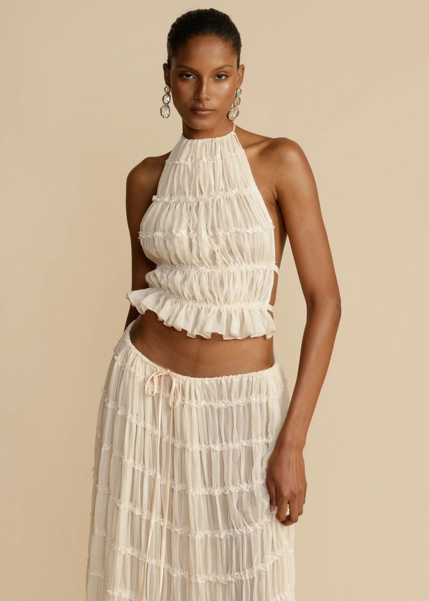 White halter crop top and pleated long skirt set with tiered ruffles and elastic waist