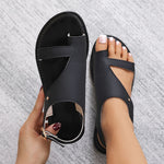 Black Roman sandals with closed toe and cutout upper, flat sole view