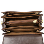Brown crossbody bag interior with multi-compartment pockets and zip divider