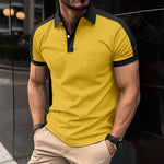 Men's yellow polo shirt with black collar trim and button placket
